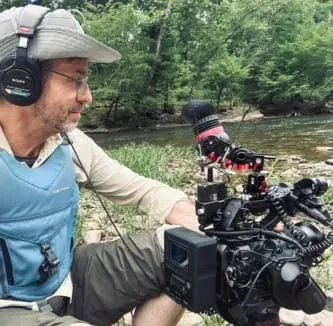 Keith Bradshaw, videographer and photographer, filming on location